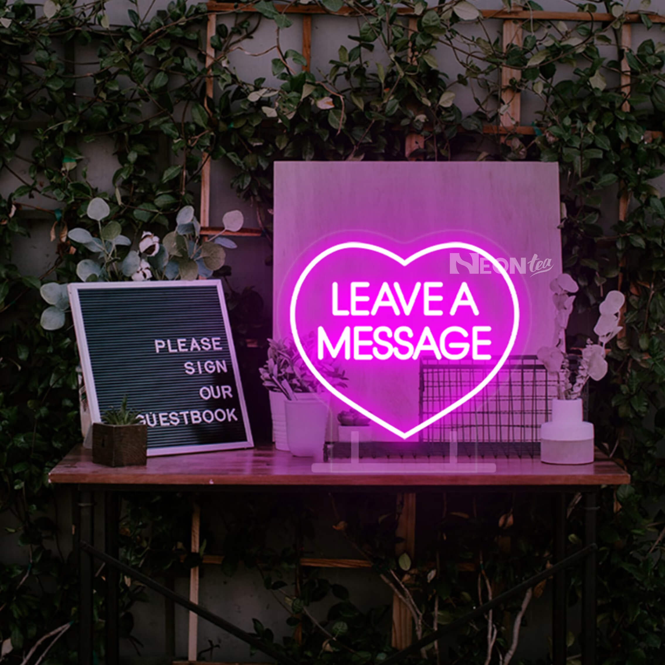 Use neon wedding signs for guestbook table