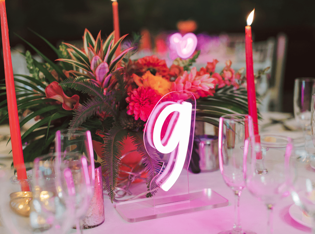 Use neon wedding signs for table numbers